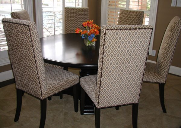 Neutral dining room with upholstered chairs