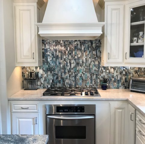 Dallas kitchen with painted cabinetry, a run of upper cabinets and integrated lighting