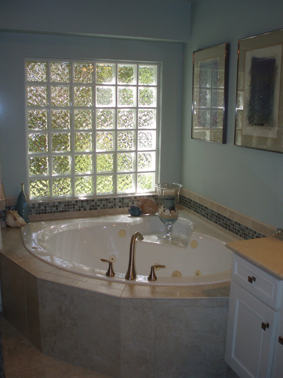 Completed primary bathroom renovation with tiled shower and new vanity