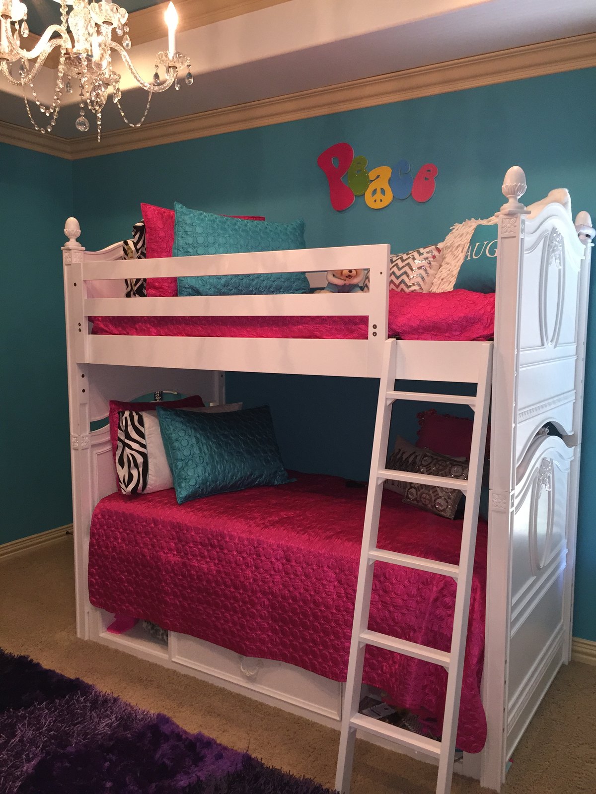 Bedroom with fitted joinery and layered lighting completed after a remodel