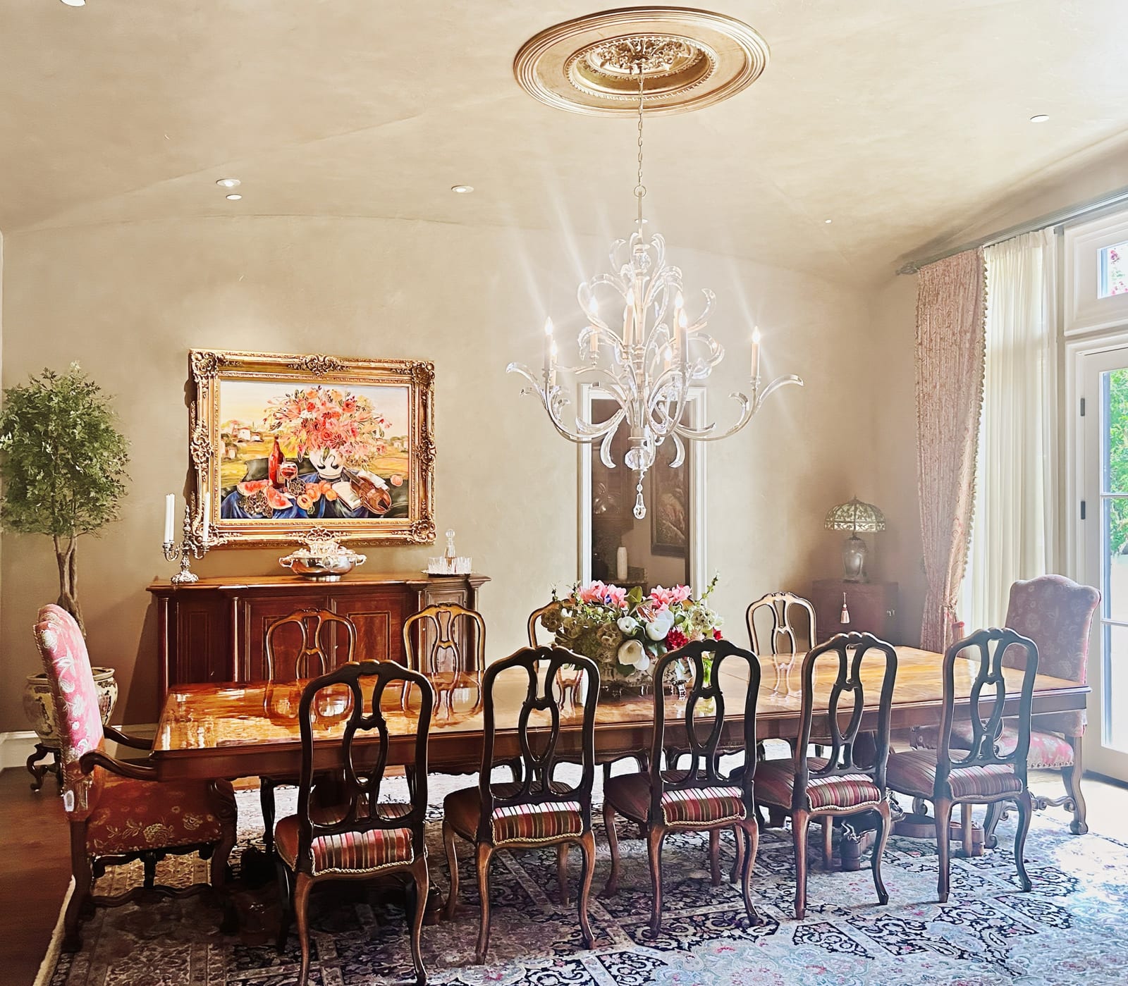 Grand dining room with a crystal chandelier, designed by Chateau Concepts